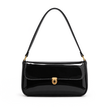 Elva Shoulder Bag with a glossy finish, decorative gold-tone clasp, front flap closure, and shoulder strap.