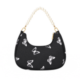 Black nylon hobo bag with white butterfly print, pearl beaded handle and gold hardware