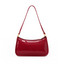Glossy burgundy red women's shoulder bag with a long strap, zip closure and gold-tone hardware on a white background.